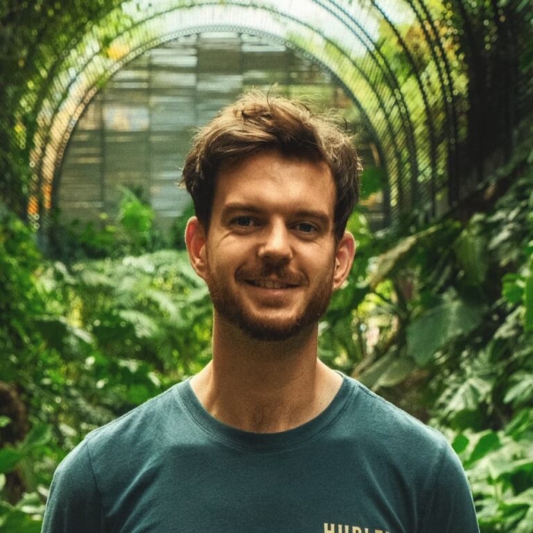 Responsible Travel Marketing Consultant, Jamie Burr, in a lush botanical garden